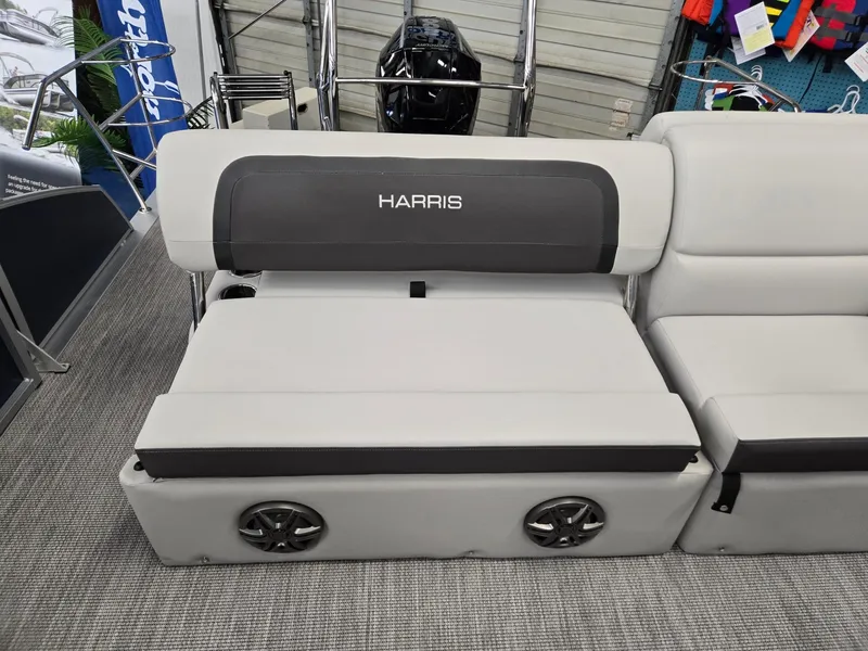 Slide: The Image of 2025 Harris Cruiser 210 boat seating with integrated speakers and sleek design. - 21