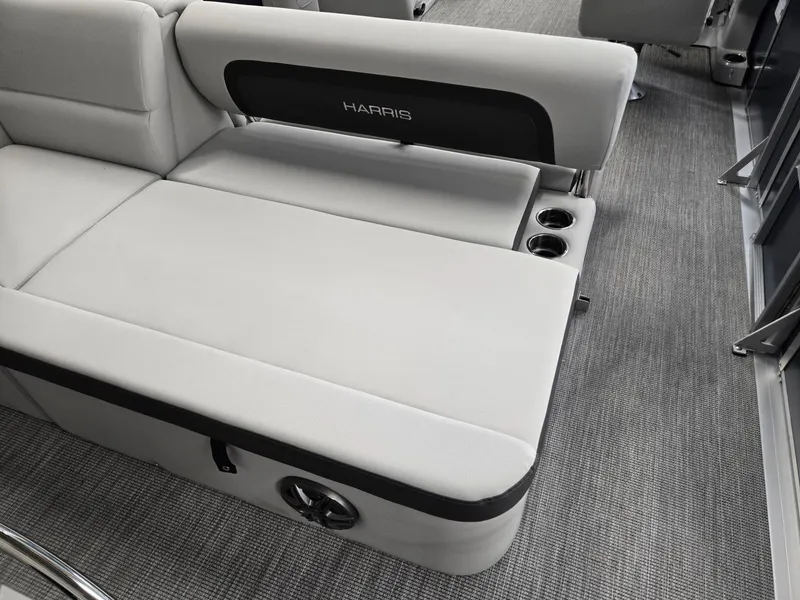 Slide: The Image of 2025 Harris Cruiser 210 boat interior with gray seating and cup holders. - 27