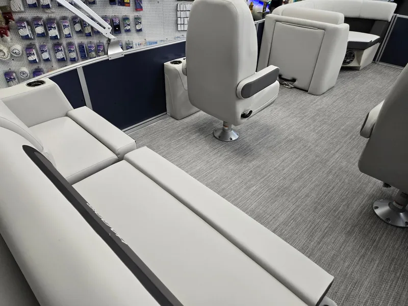 Slide: The Image of 2025 Harris Cruiser 210 interior with plush seating and modern design. - 28