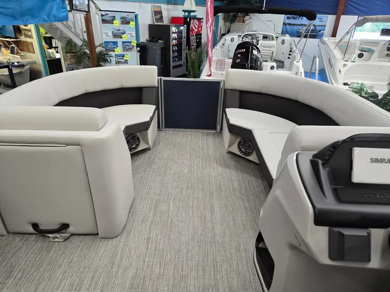 Slide: The Image of 2025 Harris Cruiser 210 pontoon boat interior with plush seating and modern design. - 29