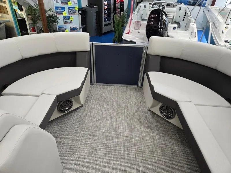 Slide: The Image of 2025 Harris Cruiser 210 interior with plush seating and modern design. - 32