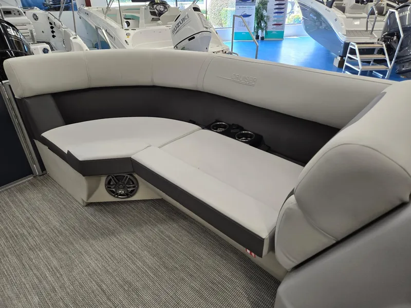 Slide: The Image of 2025 Harris Cruiser 210 boat interior with gray seating and cup holders. - 33