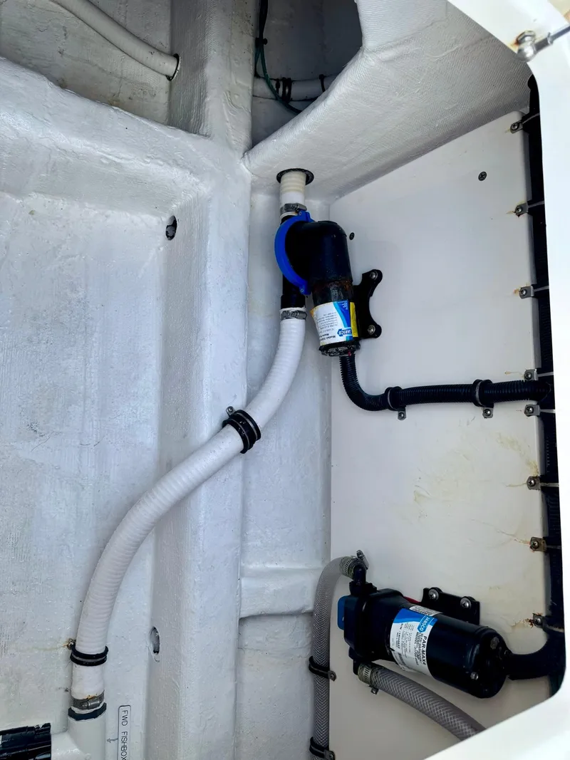 Slide: The Image of 2020 Invincible 35 Catamaran bilge area with pumps and hoses. - 25