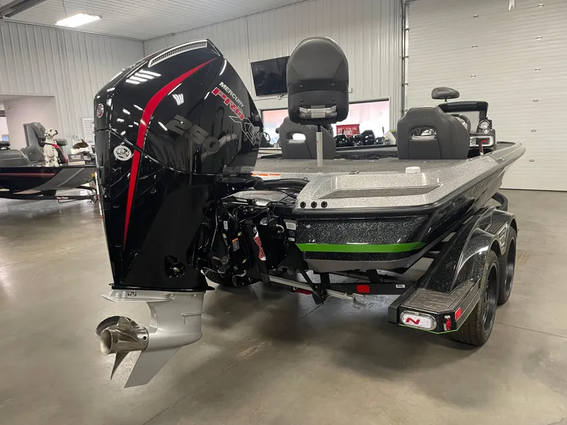 Slide: The Image of 2025 Nitro Z20 XL Pro boat in showroom, featuring powerful outboard motor. - 3