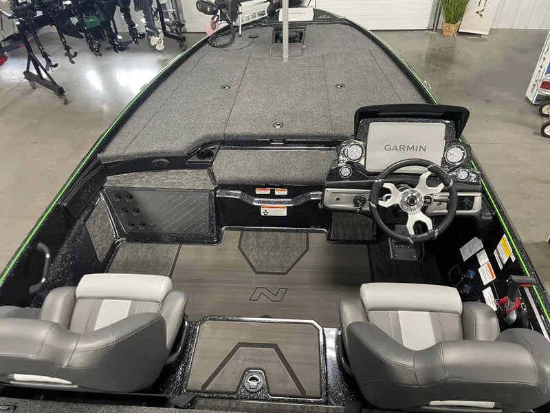Slide: The Image of 2025 Nitro Z20 XL Pro boat interior with Garmin navigation system and dual seating. - 4