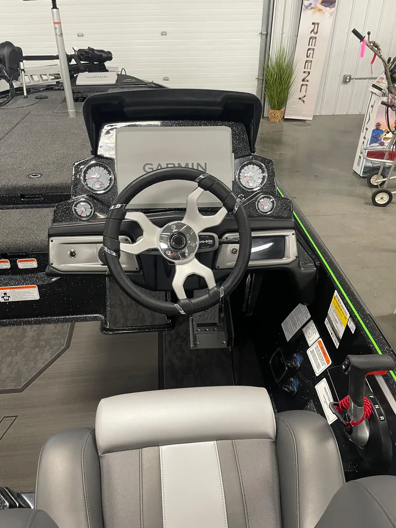 Slide: The Image of 2025 Nitro Z20 XL Pro boat dashboard with Garmin navigation system and modern steering wheel. - 5