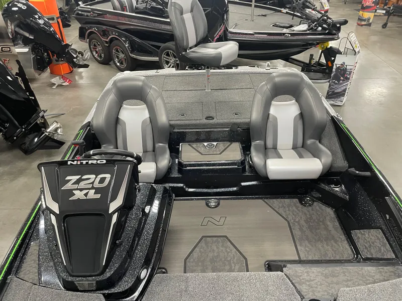 Slide: The Image of 2025 Nitro Z20 XL Pro boat interior with gray seating and sleek design. - 8