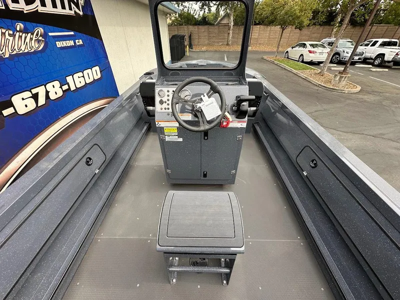 Slide: The Image of 2025 Duckworth 20 Advantage Access boat interior with steering console and seating. - 13