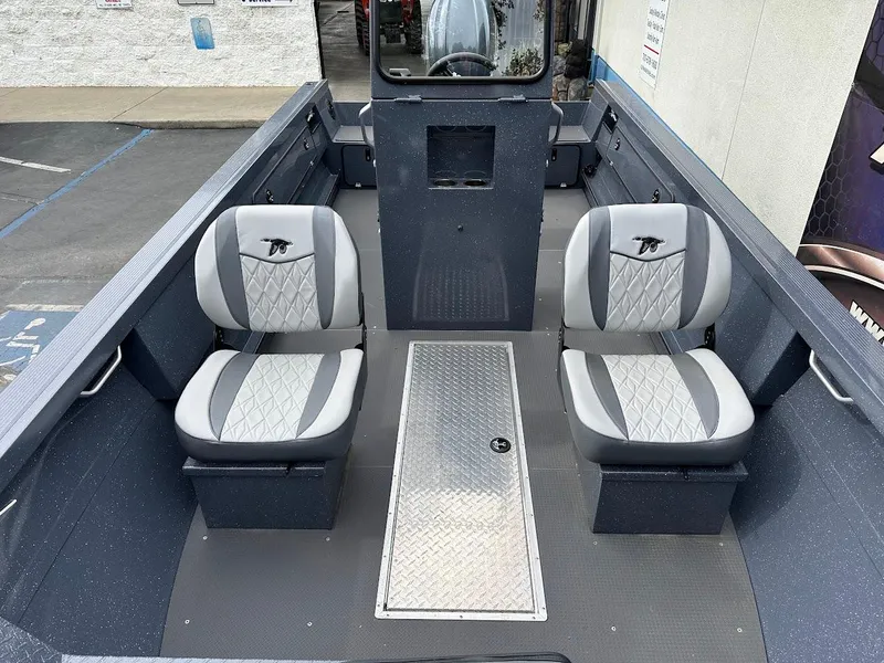 Slide: The Image of 2025 Duckworth 20 Advantage Access boat interior with two gray seats and a central storage compartment. - 17