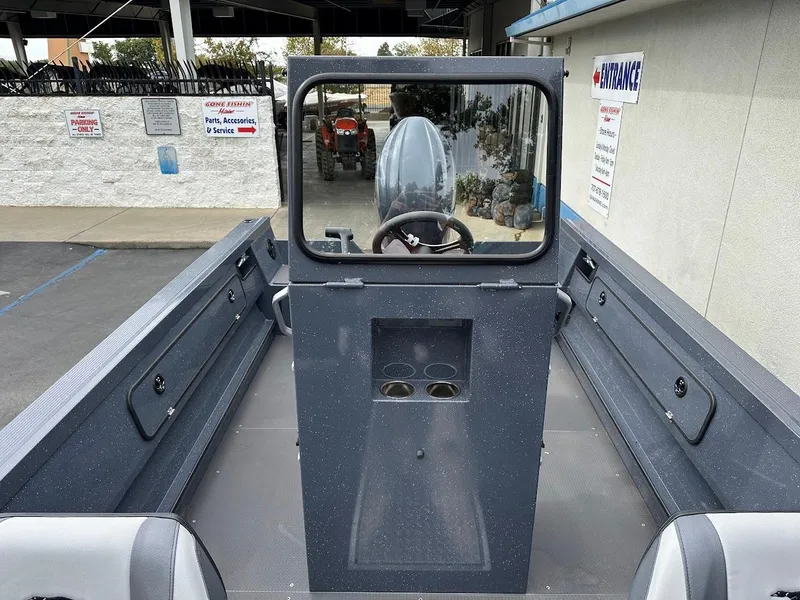 Slide: The Image of 2025 Duckworth 20 Advantage Access boat interior with steering console and seating. - 18