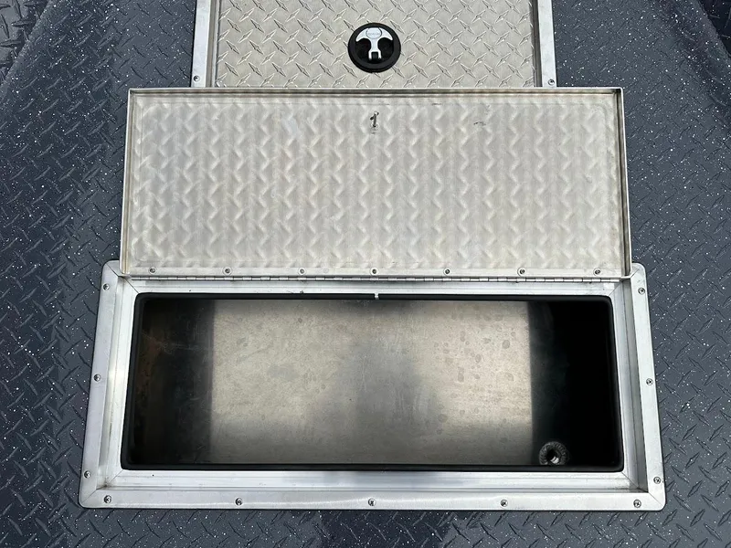 Slide: The Image of Open storage compartment on 2025 Duckworth 20 Advantage Access boat. - 20