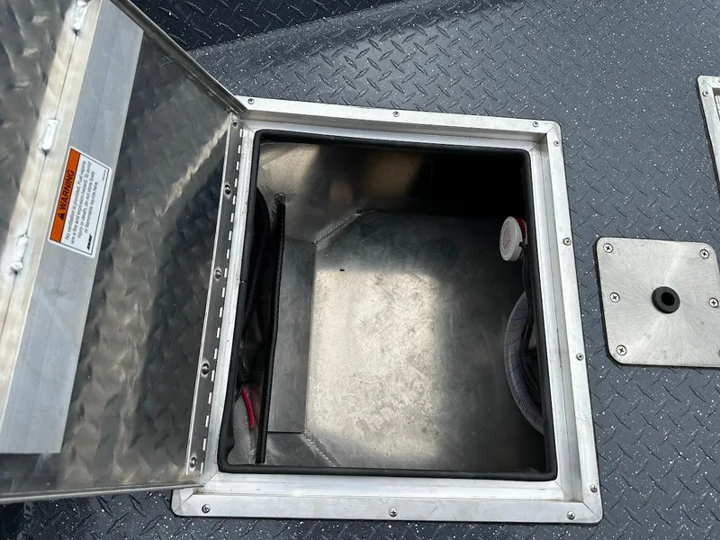 Slide: The Image of Open storage compartment on 2025 Duckworth 20 Advantage Access boat. - 21