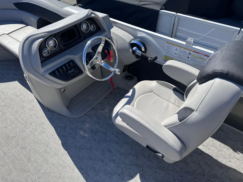 Slide: The Image of 2024 Berkshire 24RFX LE 2.75 boat interior with steering wheel and captain's chair. - 14