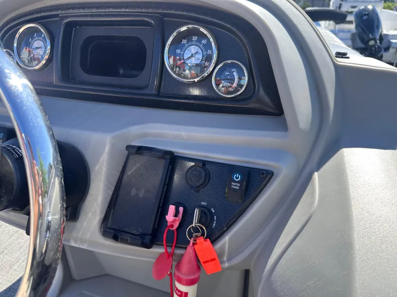 Slide: The Image of Dashboard of 2024 Berkshire 24RFX LE 2.75 boat with gauges and controls. - 16