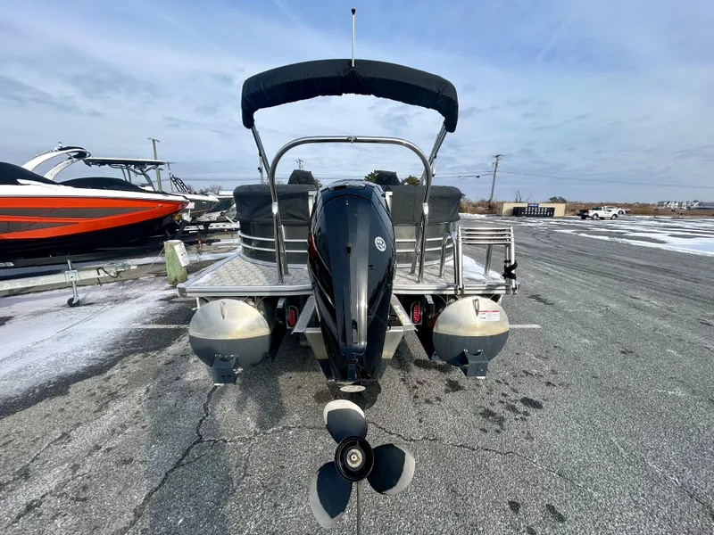 Slide: The Image of 2024 Berkshire 24RFX LE 2.75 pontoon boat, rear view with outboard motor. - 7