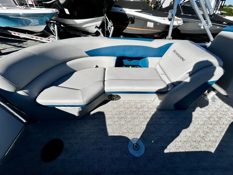 Slide: The Image of 2024 Berkshire 24RFX LE 2.75 boat interior with gray seating and blue accents. - 10