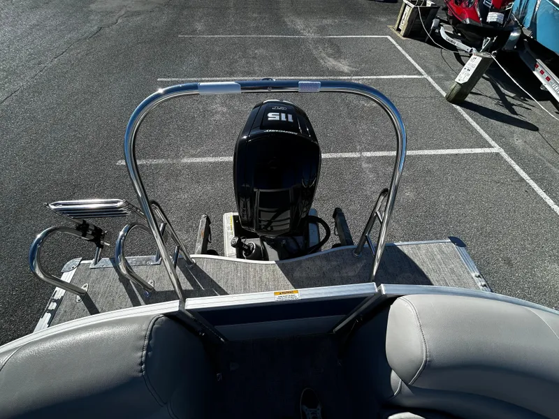 Slide: The Image of 2024 Berkshire 24RFX LE 2.75 pontoon boat with 115 HP outboard motor, rear view. - 16