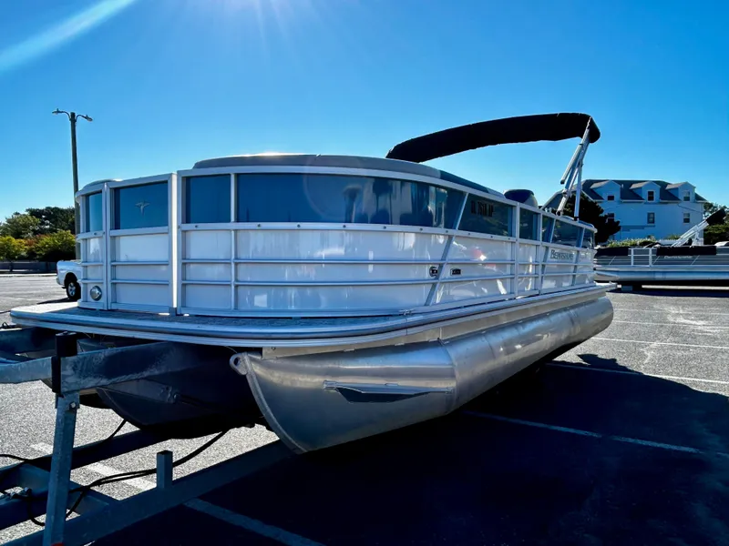 Slide: The Image of 2024 Berkshire 24RFX LE 2.75 pontoon boat parked under clear blue sky. - 4