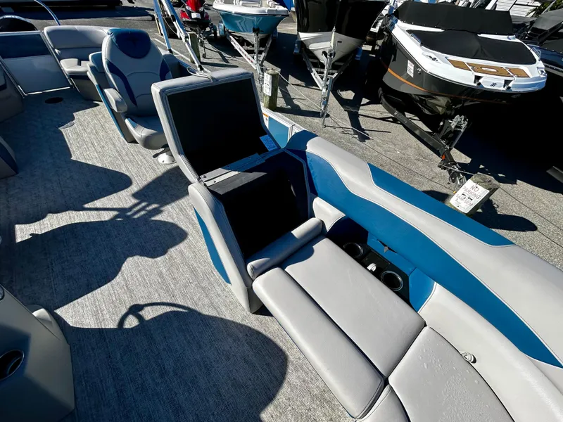 Slide: The Image of 2024 Berkshire 24RFX LE 2.75 pontoon boat interior with blue and gray seating. - 8