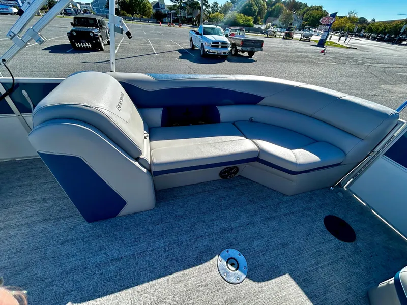 Slide: The Image of 2024 Berkshire 24RFX LE 2.75 boat interior with gray and blue seating. - 9