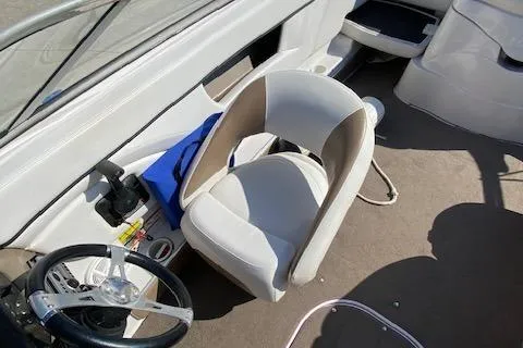 Slide: The Image of 2007 Four Winns 200 Horizon boat interior with steering wheel and seating. - 11