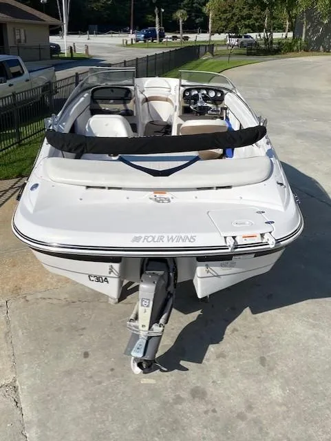 Slide: The Image of 2007 Four Winns 200 Horizon boat, rear view, parked on concrete. - 3