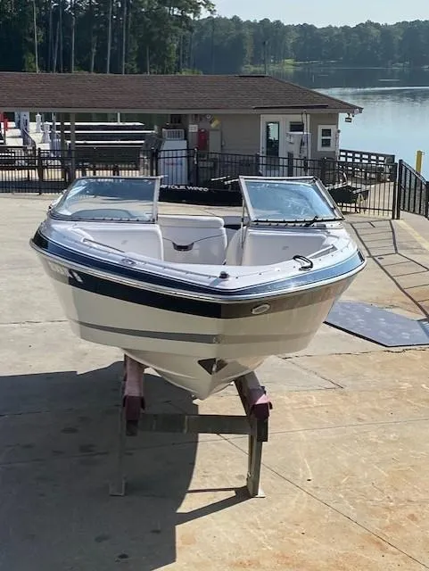 Slide: The Image of 2007 Four Winns 200 Horizon boat on dock by serene lake. - 4