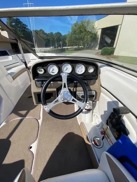 Slide: The Image of 2007 Four Winns 200 Horizon boat dashboard with steering wheel and gauges. - 5