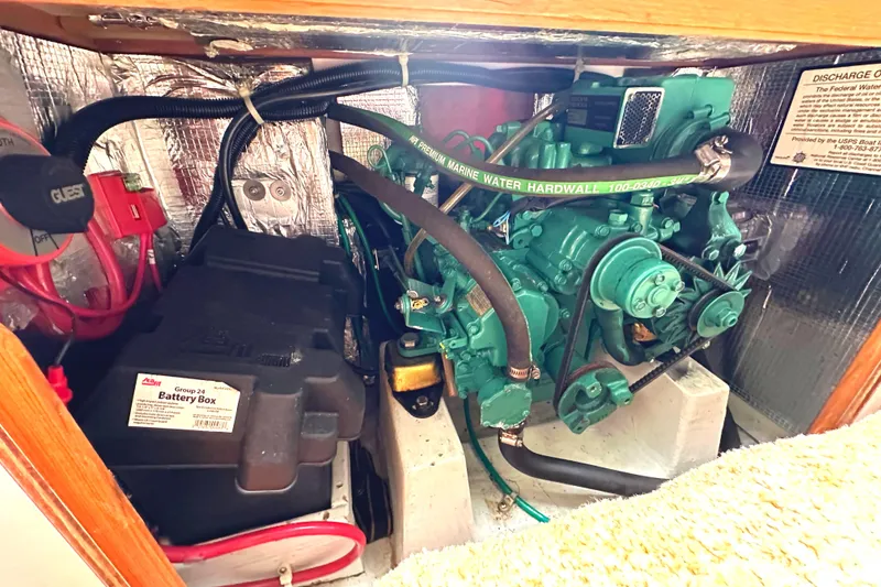 Slide: The Image of Engine compartment of 2005 Express Alerion with battery and green marine engine. - 15