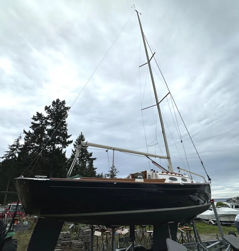 Slide: The Image of 2005 Express Alerion sailboat on stands, cloudy sky background. - 21