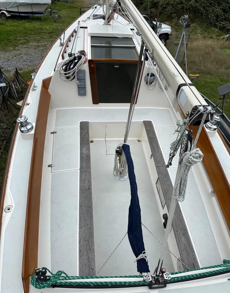 Slide: The Image of 2005 Express Alerion sailboat deck with wooden trim and rigging. - 24