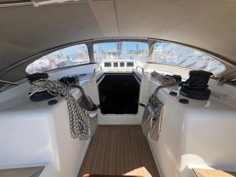 Slide: The Image of Cockpit of 2013 Nautor Swan 53 yacht with ropes and winches, featuring a sleek design. - 10