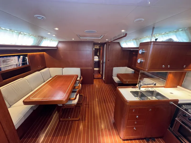 Slide: The Image of Luxurious interior of 2013 Nautor Swan 53 yacht with elegant wood finish and spacious seating. - 11