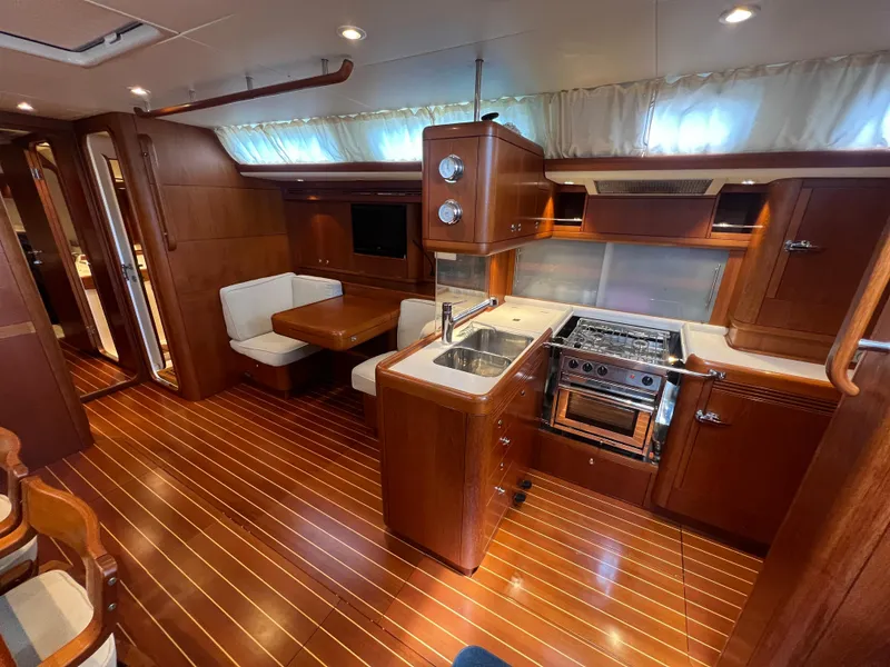 Slide: The Image of Luxurious interior of 2013 Nautor Swan 53 yacht with modern kitchen and dining area. - 12