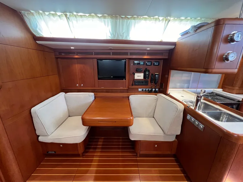Slide: The Image of Luxurious Nautor Swan 53 yacht interior with wooden finish and cozy seating, 2013 model. - 13