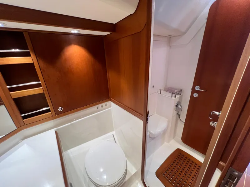 Slide: The Image of Luxurious bathroom in 2013 Nautor Swan 53 yacht with wooden accents and modern fixtures. - 17