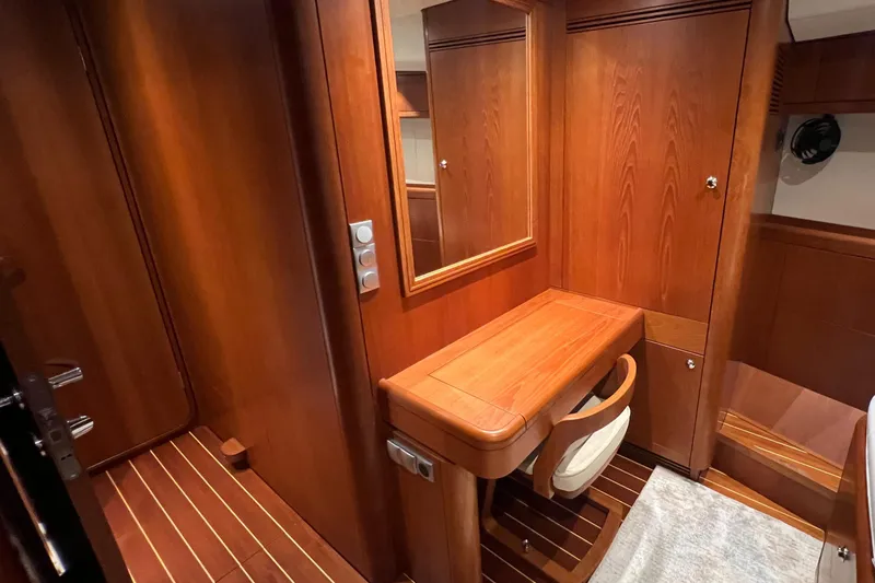 Slide: The Image of Luxurious wooden interior of 2013 Nautor Swan 53 yacht cabin with desk and chair. - 19