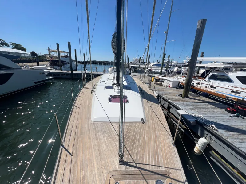Slide: The Image of Sailing yacht Nautor Swan 53, 2013 model, docked at marina under clear blue sky. - 2