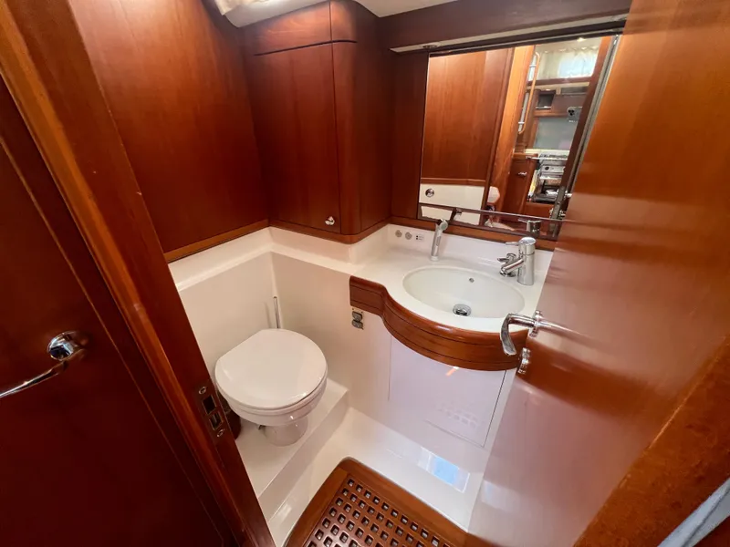 Slide: The Image of Luxurious Nautor Swan 53 yacht bathroom with wooden finish, modern sink, and toilet, 2013 model. - 21