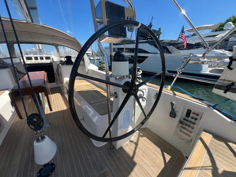 Slide: The Image of Cockpit of 2013 Nautor Swan 53 yacht with steering wheel and control panel. - 6