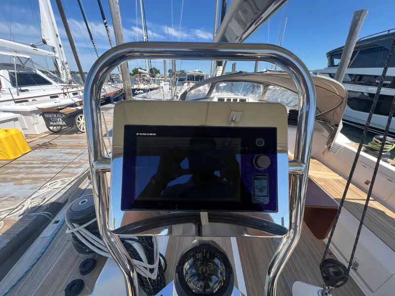 Slide: The Image of Cockpit of 2013 Nautor Swan 53 sailboat with navigation equipment and compass. - 9