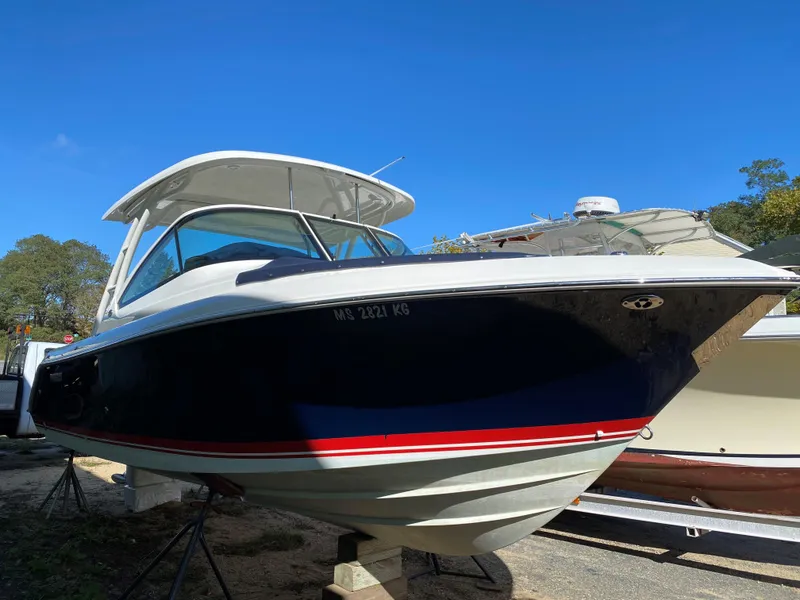 Slide: The Image of 2021 Pursuit DC 235 Dual Console boat on display, featuring sleek design and modern features. - 2