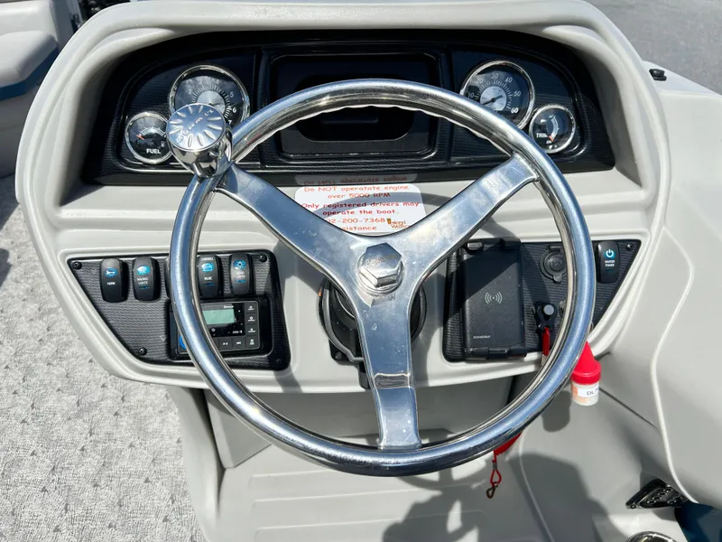 Slide: The Image of Steering wheel and dashboard of 2024 Berkshire 24CL LE 2.75 boat. - 8