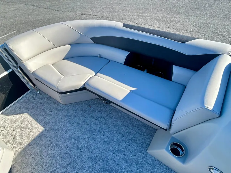 Slide: The Image of 2024 Berkshire 24CL LE 2.75 pontoon boat interior with plush seating and modern design. - 13