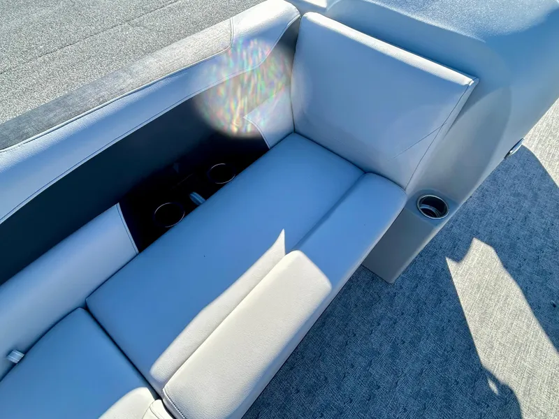 Slide: The Image of 2024 Berkshire 24CL LE 2.75 boat interior with gray seating and cup holders. - 15