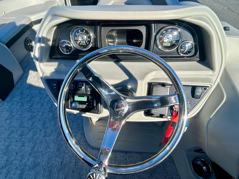 Slide: The Image of Steering wheel and dashboard of 2024 Berkshire 24CL LE 2.75 boat. - 19