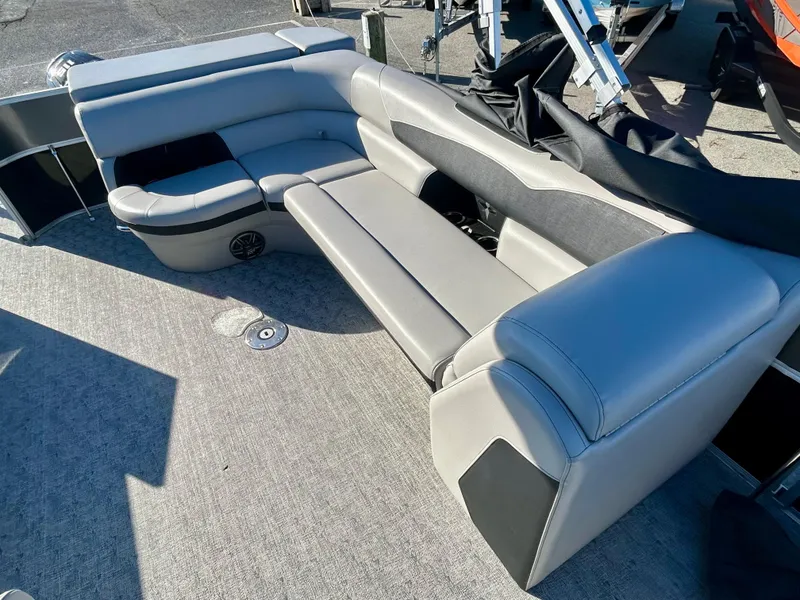 Slide: The Image of 2024 Berkshire 24CL LE 2.75 boat interior with gray seating and carpeted floor. - 8