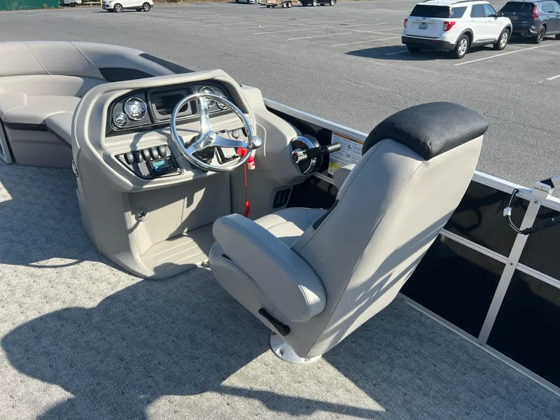 Slide: The Image of 2024 Berkshire 24CL LE 2.75 boat interior with steering console and captain's chair. - 11