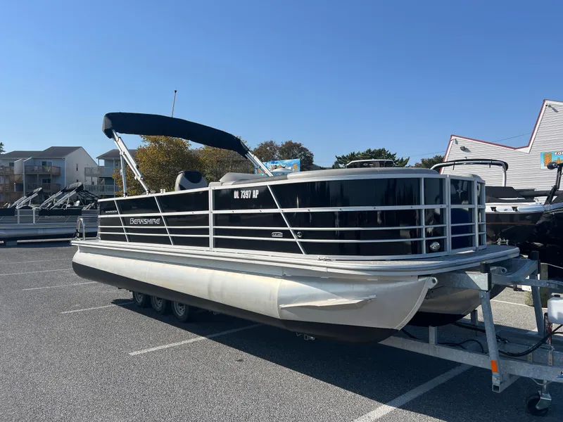 Slide: The Image of 2024 Berkshire 24CL LE 2.75 pontoon boat on trailer in parking lot. - 3