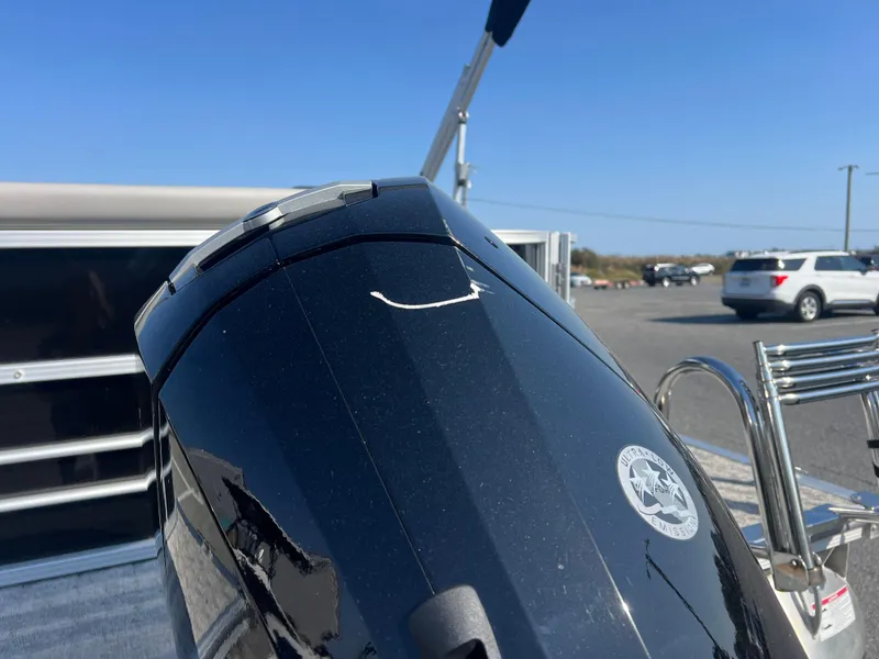 Slide: The Image of 2024 Berkshire 24CL LE 2.75 boat engine close-up in a parking area. - 5